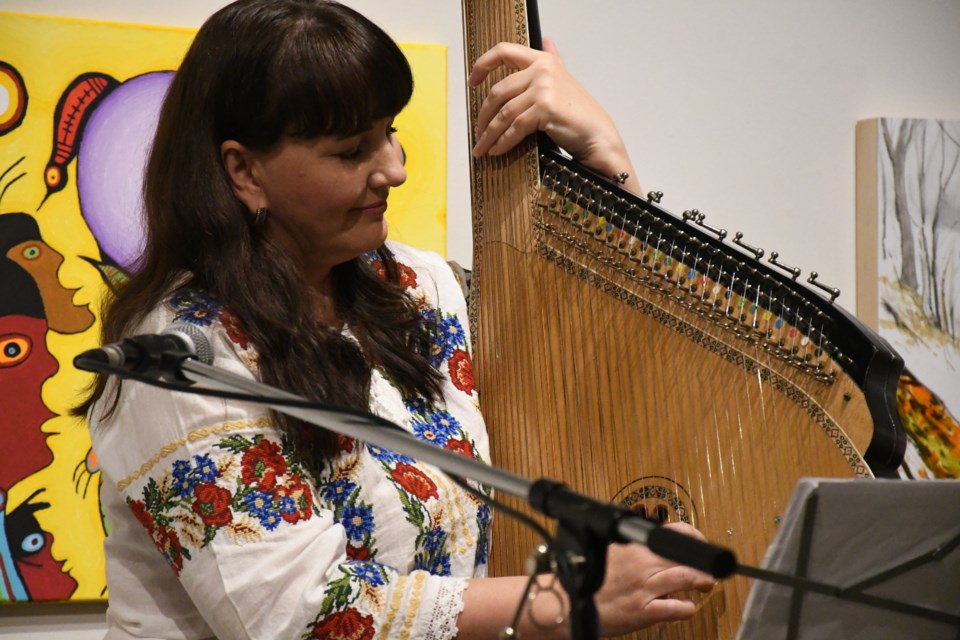 Iryna Levchenko performs a number of traditional Ukrainian melodies on the bandura on Dec. 14.