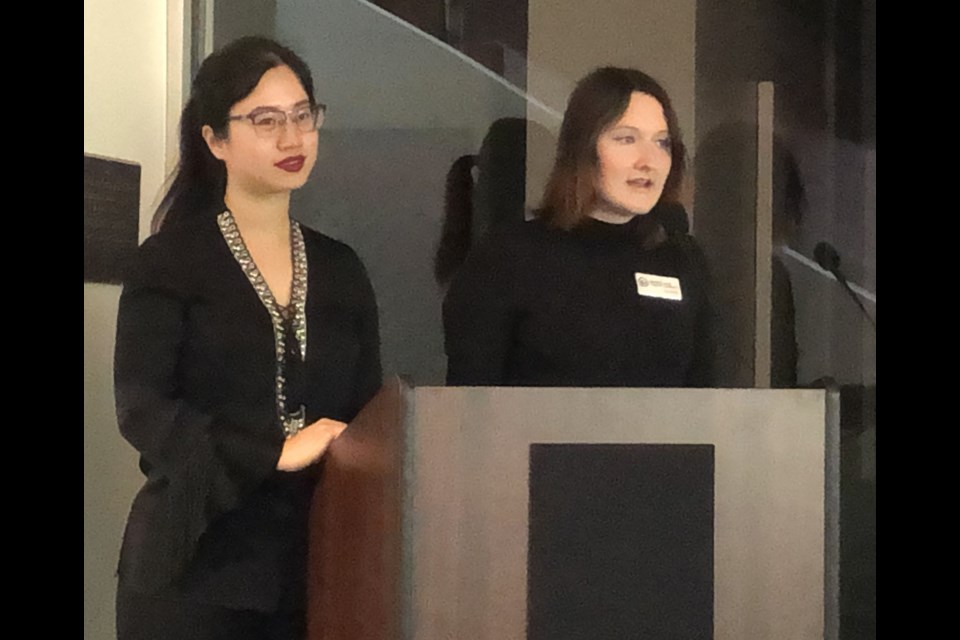 Violet Tang, operations manager at the Moose Jaw Museum and Art Gallery (left) and Jennifer Doede, the library's community outreach librarian, help launch the new exhibition celebrating the Royal Canadian Air Force's centennial. Photo by Jason G. Antonio