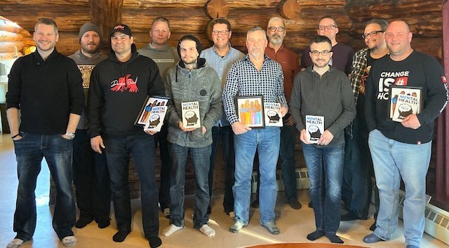 Twelve of the 16 men who contributed a story to the book MENtal Health: It’s Time to Talk, gather for a picture. Author and mental health advocate Allan Kehler wrote the book to help men understand that it’s OK to be vulnerable and open about their mental health. Photo contributed