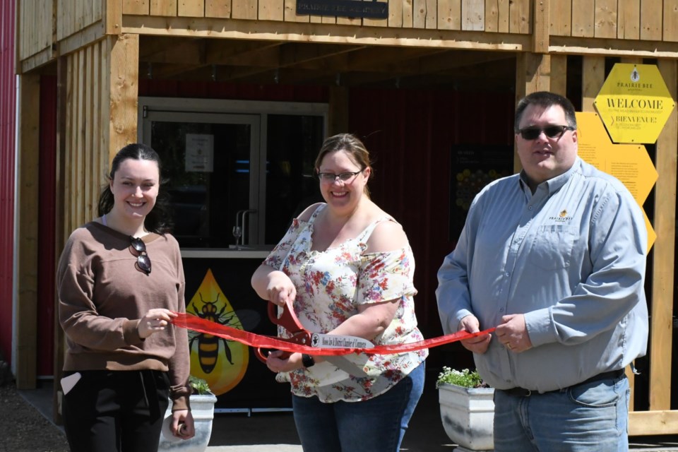 Darby Fiddler, Crystal Milburn and Gerard Milburn cut the ribbon to officially open the new tourist attractions. 