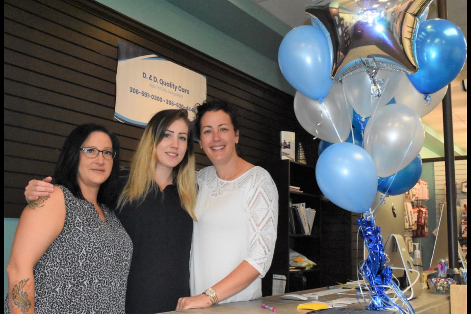 Tricia Hunt, Cassie Duckworth and Cher Duckworth-Hajósi celebrate the grand re-opening of their business, D. & D. Quality Care on Sept. 3. Owner Duckworth-Hajósi moved the business to 428 Main Street from 11 Hochelaga Street. Photo by Jason G. Antonio