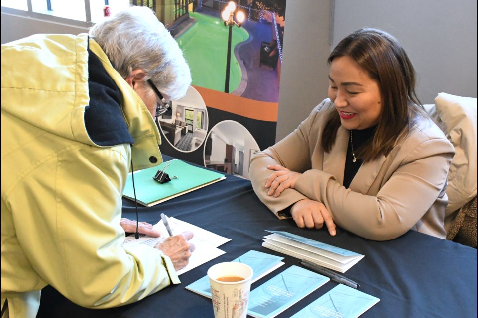 A prospective new hire fills out an application for a job at the Temple Gardens Hotel & Spa during the Senior Moose Jobs networking event on Feb. 13.