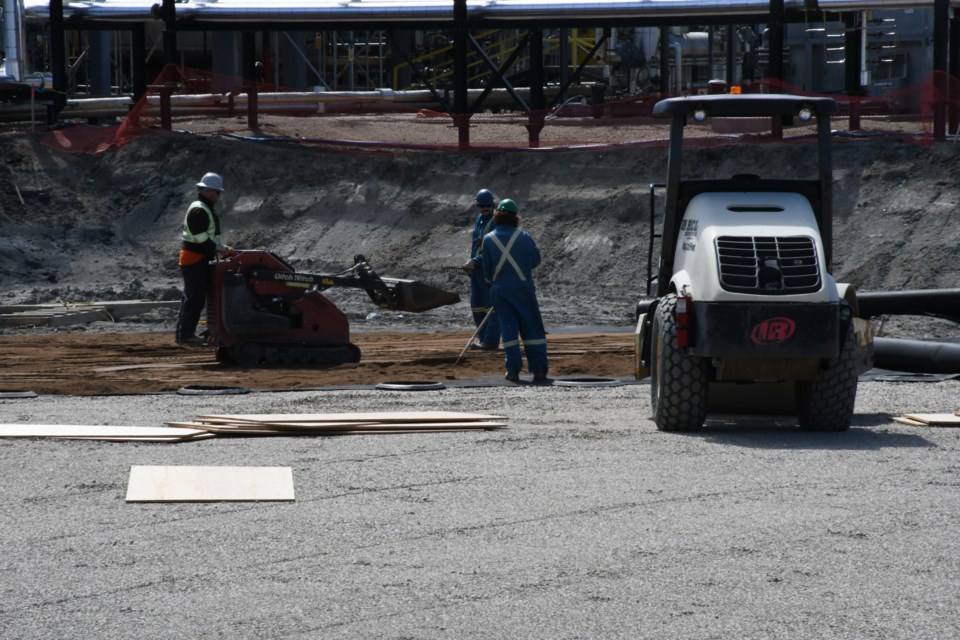 Employees work to upgrade the site. Photo by Jason G. Antonio