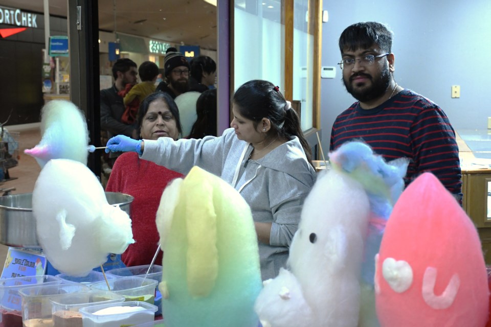 Monkey Bars Indoor Playcentre staff provide fun cotton candy figurines during Family Fun Day at the Town ‘N’ Country Mall on Feb. 15.