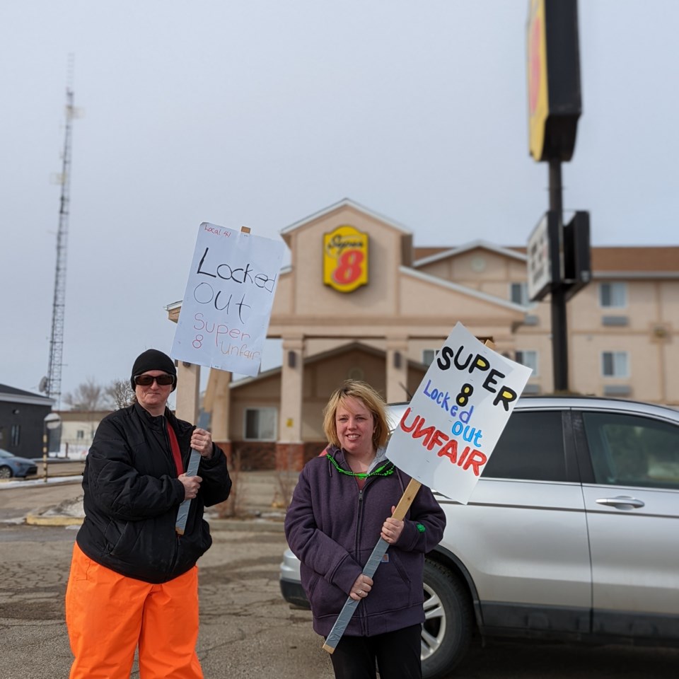 Two Super 8 Moose Jaw employees who have been locked out since March 3 are walking a picket line in protest against what they say are unfair labour practices