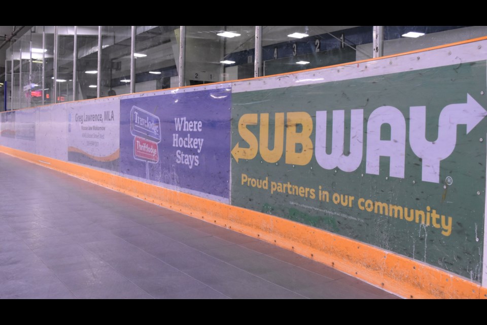 Advertising signs line the boards at the Kinsmen Arena. A new advertising and sponsorship policy will provide clarity about where and what advertising signs can be placed in all city-owned buildings, parks, structures or public events. Photo by Jason G. Antonio