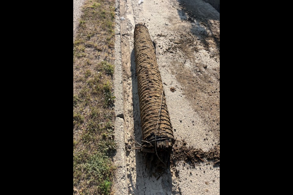 The wood water pipe that contractors dug up near the intersection of Coteau Street East and Ninth Avenue 鶹Ƶwest. Photo courtesy Facebook