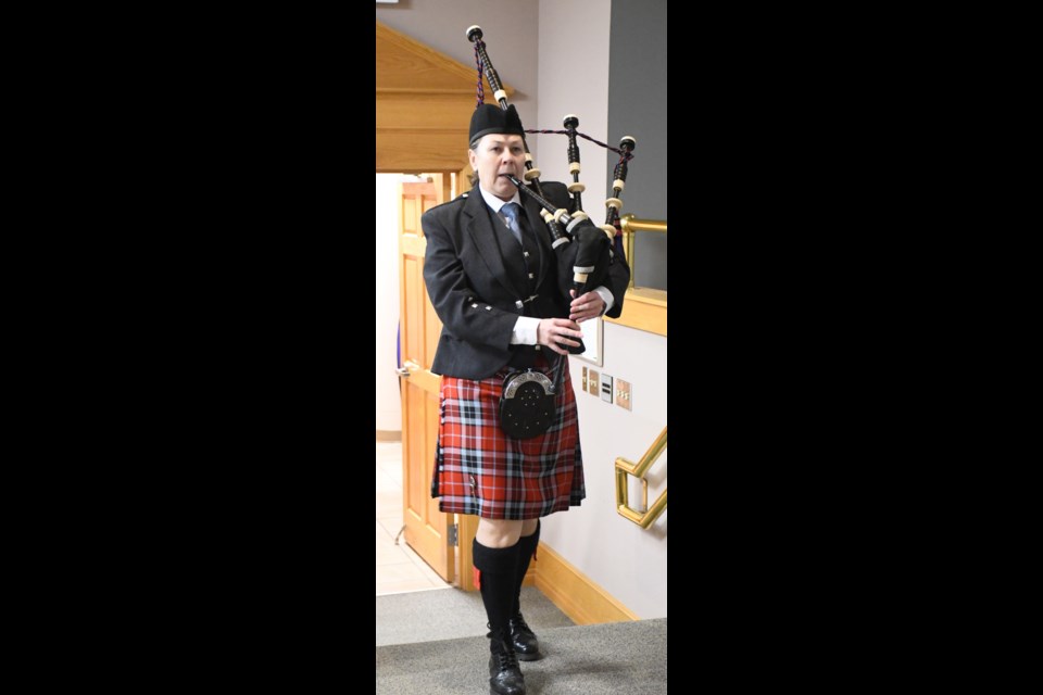 Piper Michelle Gallagher leads council members and dignitaries into the chamber. Photo by Jason G. Antonio