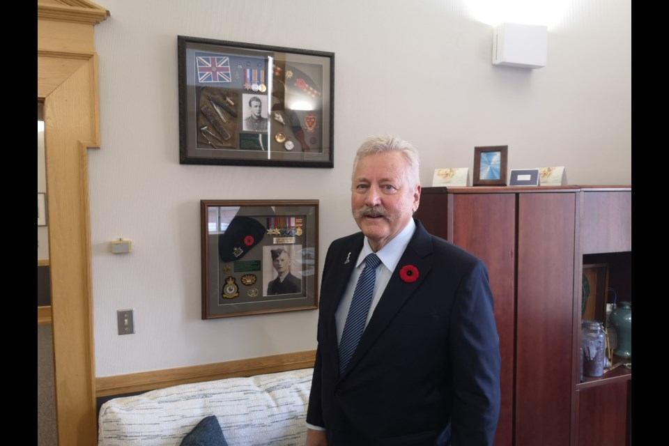 Mayor Clive Tolley displays his memorial shadow boxes put together by his brother Anthony (Tony) Tolley on Oct. 26, 2023.