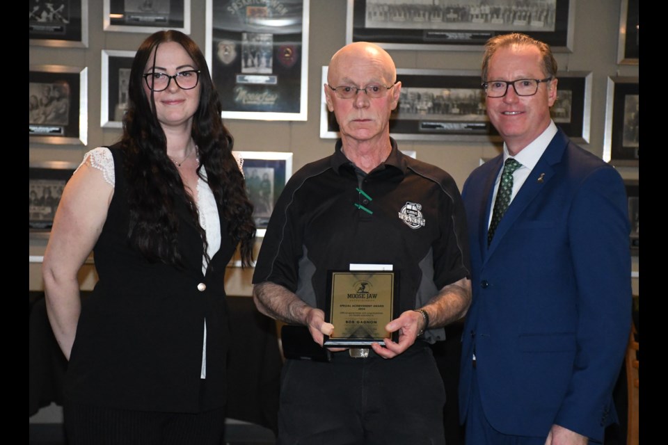 Bob Gagnon (middle) is presented with the special achievement award, flanked by transportation manager Krysti Johre and Mayor James Murdock. Photo by Jason G. Antonio