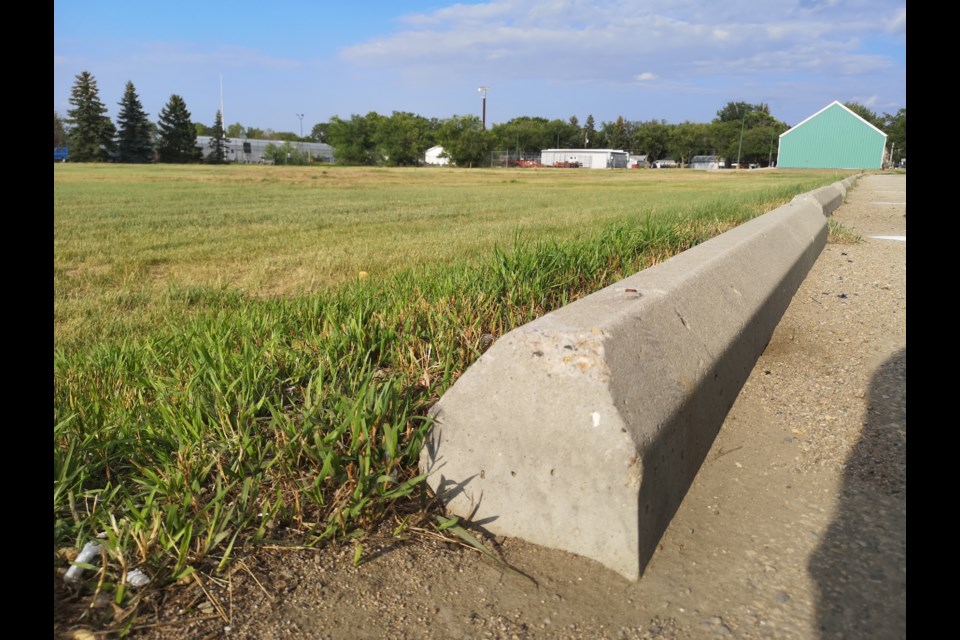 A four to five inch section of rebar that was formerly protruding from these parking curbs has since been repaired.