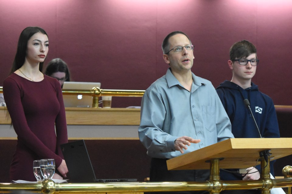 A.E. Peacock Collegiate science teacher Stephen Lys (centre), along with his students Brittney Anderson and Rylan Downey, speak to council about banning single-use plastic bags from Moose Jaw, during the April 11 executive committee meeting. Photo by Jason G. Antonio 