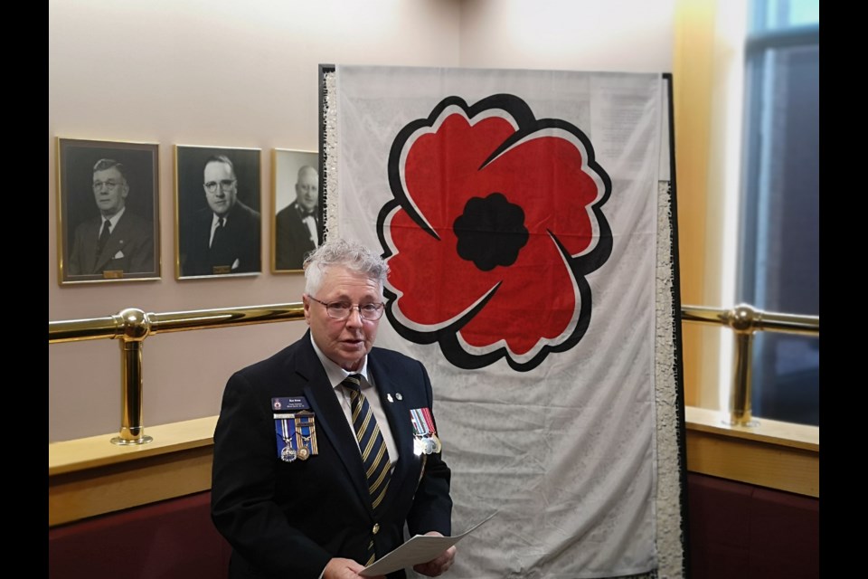 Sue Knox, the Legion's poppy chairperson, gave a speech before presenting the first poppy of 2023 to Mayor Tolley.