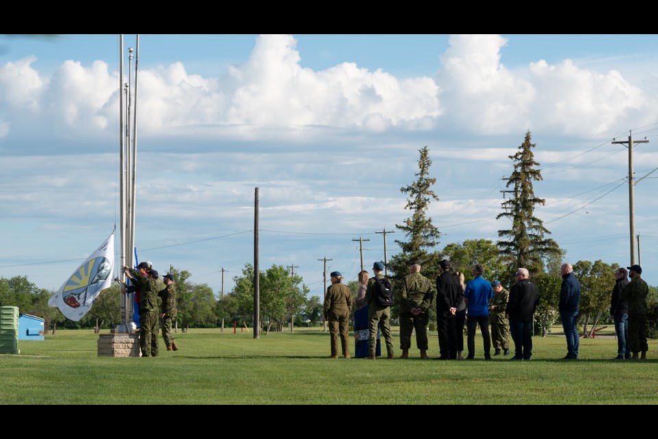 The flag being raised at 15 Wing Moose Jaw in recognition of National Indigenous People's Day.