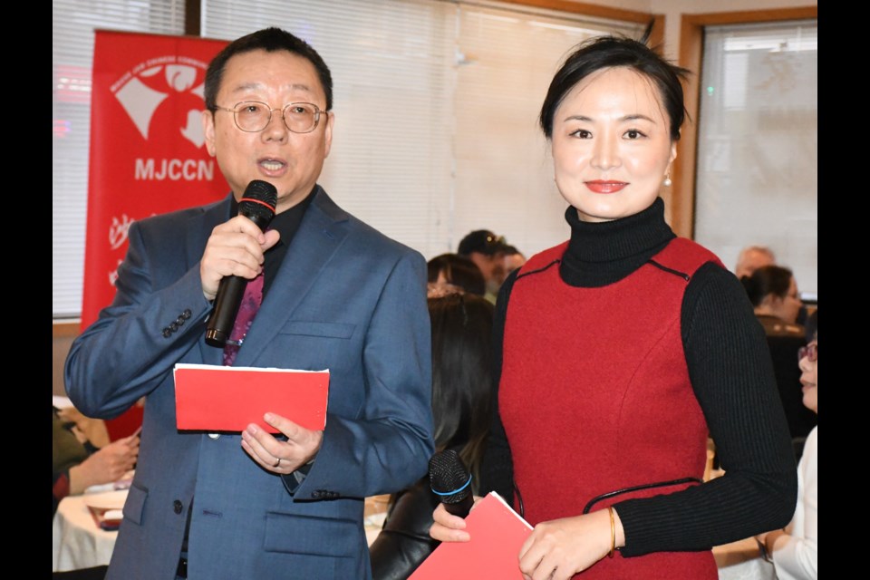 Qiang (Kelvin) Hu, MJCCN president (left), and Lian Ning act as banquet co-MCs.