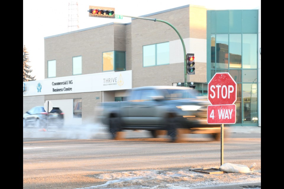 The intersection of First Avenue Northwest and High Street West will remain a four-way stop until at least mid-March, according to city hall. Photo by Jason G. Antonio 