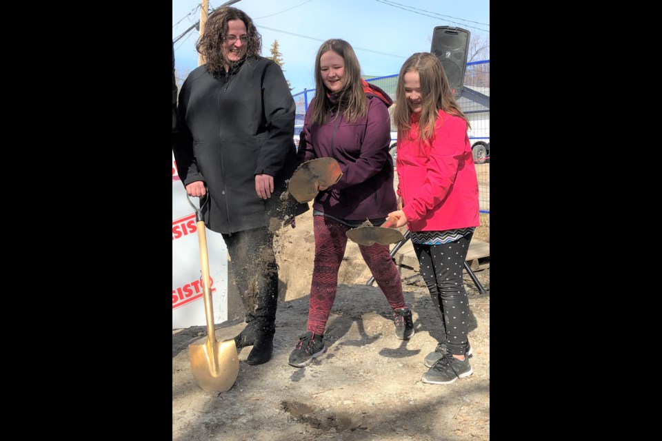 Tanya Legare and her daughters, Brooklynn and Chelsea, help with a sod-turning ceremony to officially kick off Habitat for Humanity’s ninth build in Moose Jaw. Photo by Jason G. Antonio 