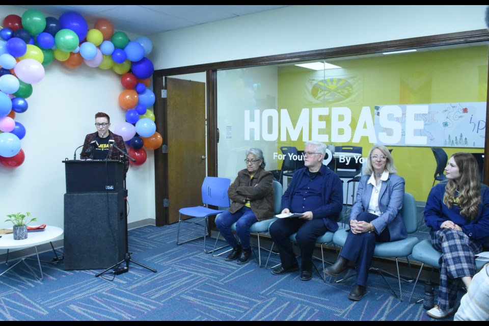 Amanda Neuman, manager of communications and stakeholder relations with the John Howard Society of Saskatchewan (at podium), MCs the ceremony. Photo by Jason G. Antonio