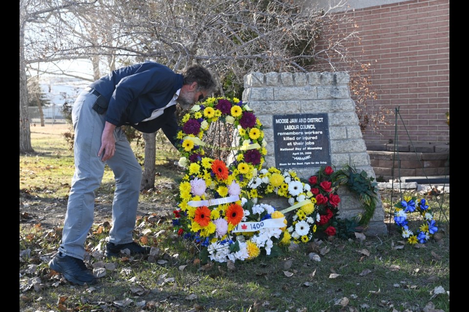 One of the many wreathes laid in memory of those who died while on the job at a ceremony on Friday afternoon 