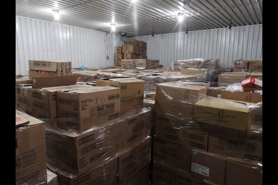 After the Better Together Food Drive concluded, the warehouse was so packed the door couldn't close.