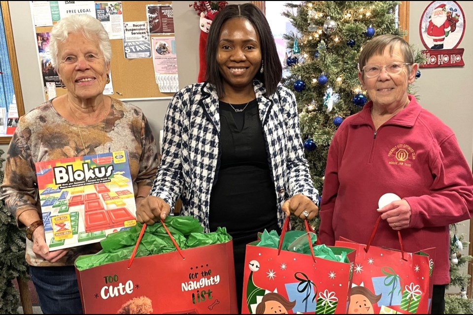 Lynann Pethick (right), president of the Friendly City Optimist Club, presents Christmas gifts donated to The Salvation Army in Moose Jaw in December 2024. Ghislaine Rensby (left) is the Optimist Club’s chair and Obehi Afuah (centre) is an employee of The Salvation Army.