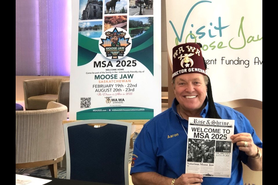 Aaron Ruston, director general of the Midwest Shrine Association (MSA), greets members in the foyer of the Temple Gardens Mineral Spa and Hotel. 