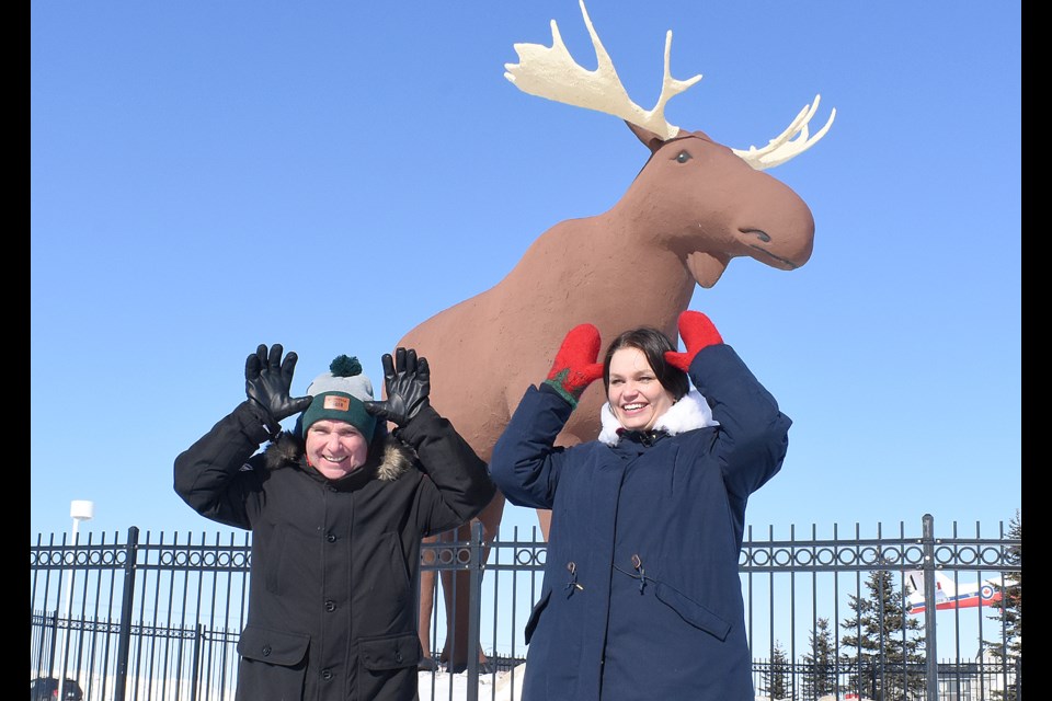 Moose Jaw mayor Fraser Tolmie and Stor-Elvdal deputy mayor Linda Otnes Henriksen do the 'moose antlers' in front of Mac the Moose.