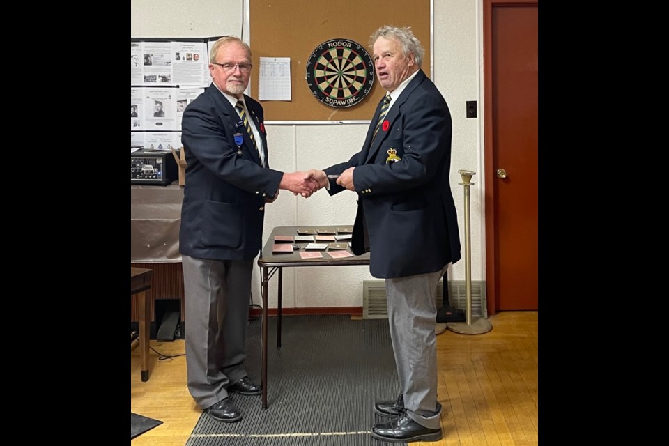 Central Butte Legion president Reg Stewart with past-president award recipient George Willard.