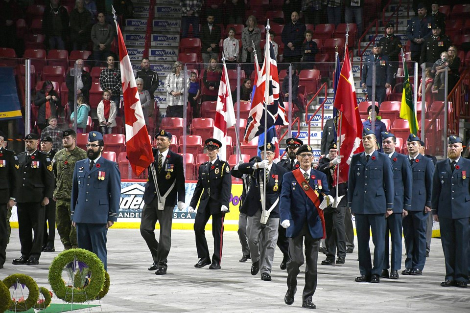 The colour party arrives in the Moose Jaw Events Centre.