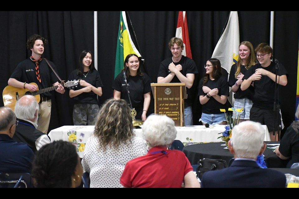 The current group of Rotary exchange students in District 5550 perform a tune during their presentation.