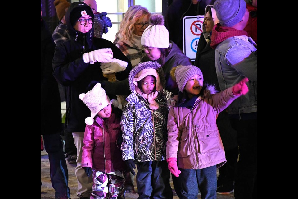 Youngsters wait in anticipation for the start of the Santa Claus Parade.