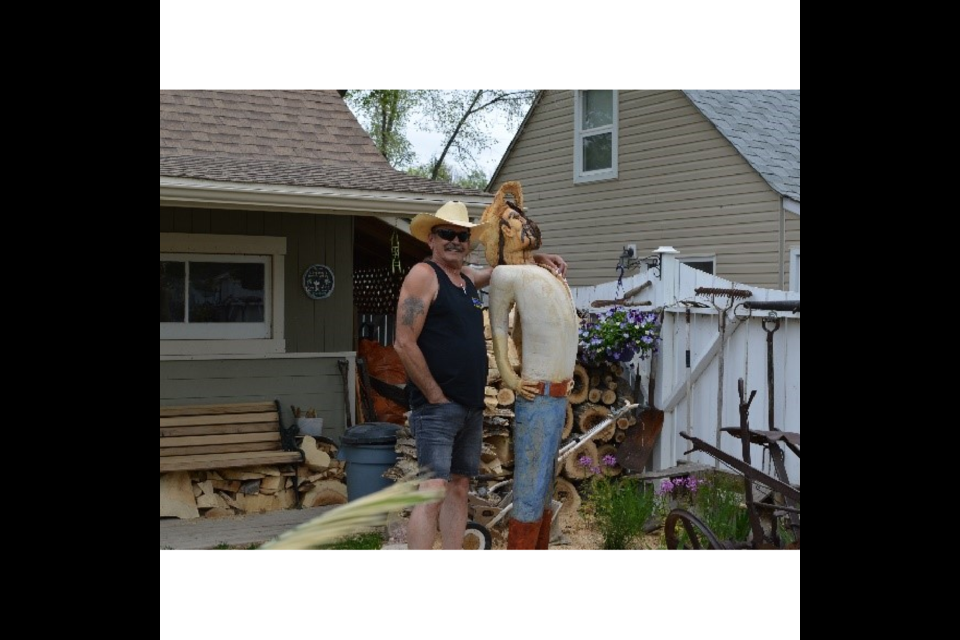 Scott Jenkinson and his woodcarving.