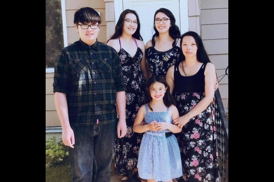 Sherry Ma (far right) in a family photo with her four children.