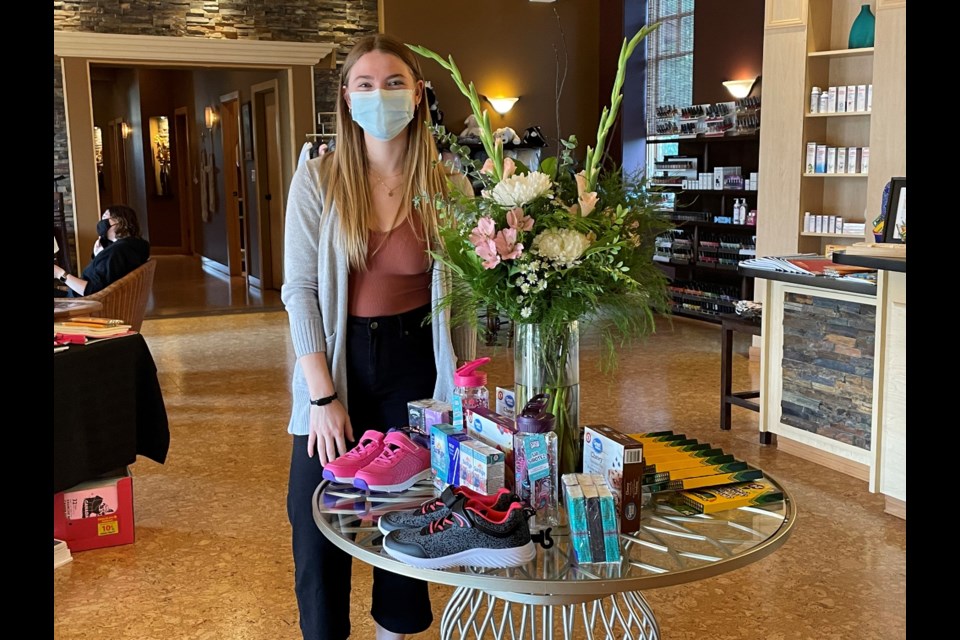 Teralyn Ross, Spa Coordinator at Sahara Spa in Moose Jaw, displays some of the school supplies they've collected as part of the spa's Giving is Beautiful initiative.