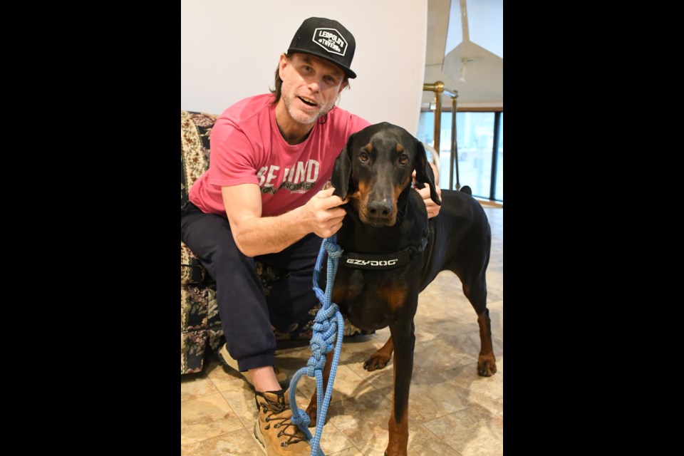 Michael Vernon and his support dog, Maverick. Photo by Jason G. Antonio