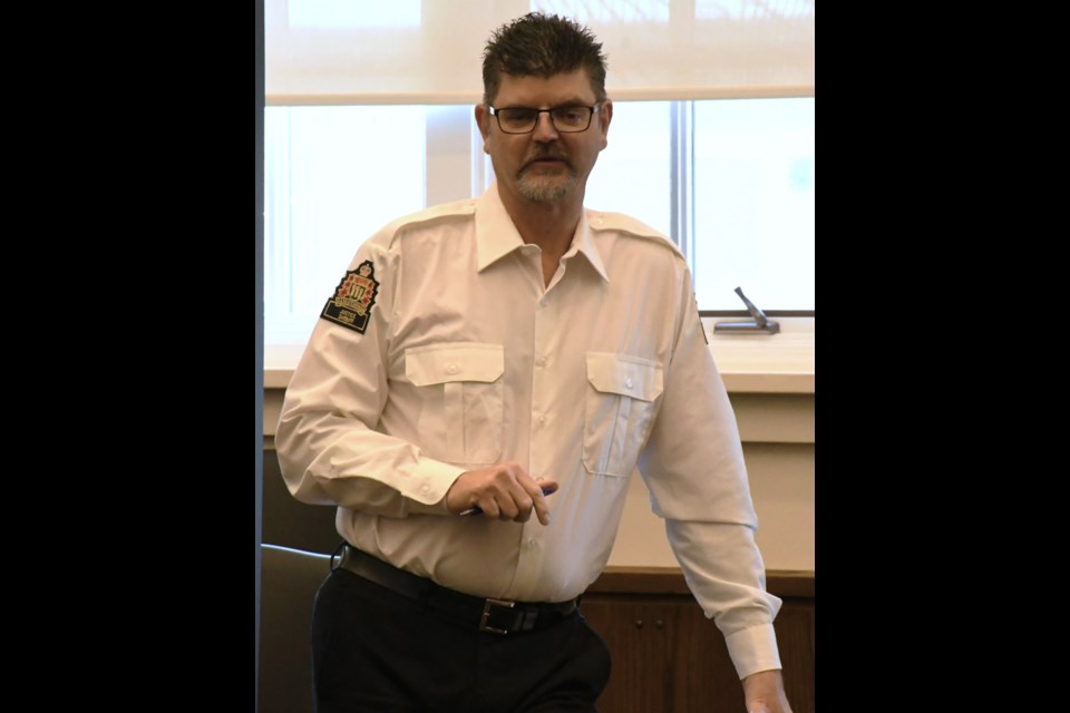 Sheriff Warren Miller speaks to students how about the mock trial will work before the start of the event. Photo by Jason G. Antonio