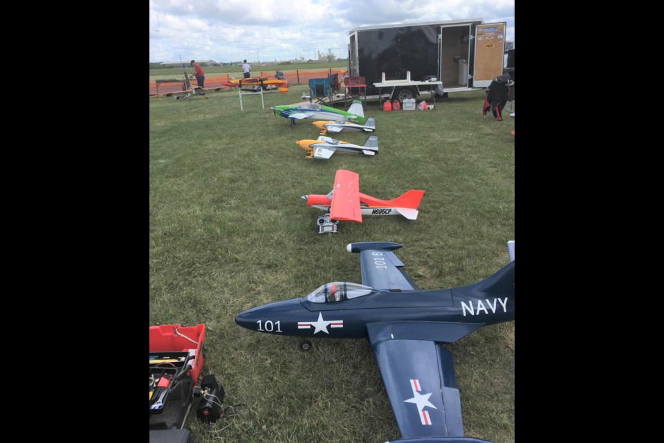 Various models of radio-controlled aircraft are lined up before the start of the Pity-Pat Fun Fly. Photo courtesy Kerry Olson  