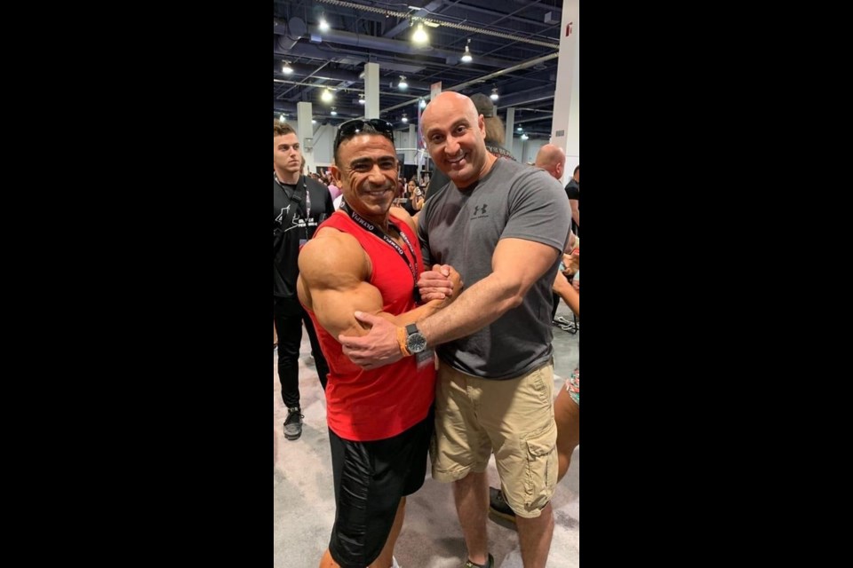 Youssef Al-Begamy, on right, poses with his friend, a champion bodybuilder 