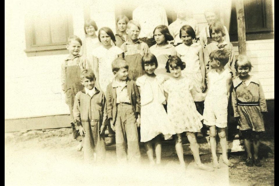 Keelerville School  (District # 1111 Sec 29 Tsp 21 Rge 28 W of the 2 Meridian) class photo June 1932 - from the archives of Marjorie Russell/Thomas. This was Marjorie’s first school. If you look closely you can see children both wearing shoes or in bare feet. Most of the children though are bare foot.

In the past all farm children had to and were expected to work some very hard and labour intensive jobs on the farm.