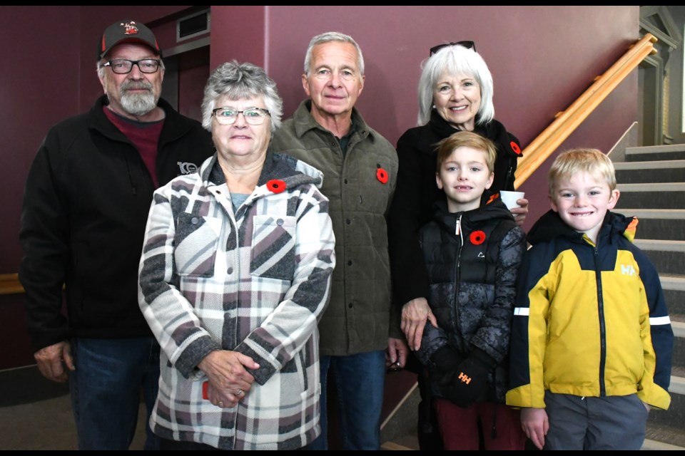 Some members of the James Burleigh Hill family gather for a picture after the ceremony. From left are Brian Hill, Marilyn Tighe, nephew (Calvin) Burleigh Hill, Chris Hill, Finn Olfert and great-great-nephew Burleigh Kempe. Photo by Jason G. Antonio