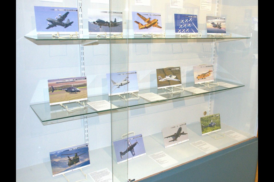 A display case featuring pictures of aircraft that the Royal Canadian Air Force flies. Photo by Jason G. Antonio