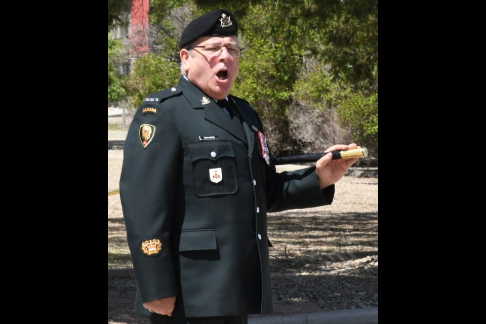 Sgt. Maj. Rob Tryhorn barks out orders at the armoury as the unit forms up. Photo by Jason G. Antonio