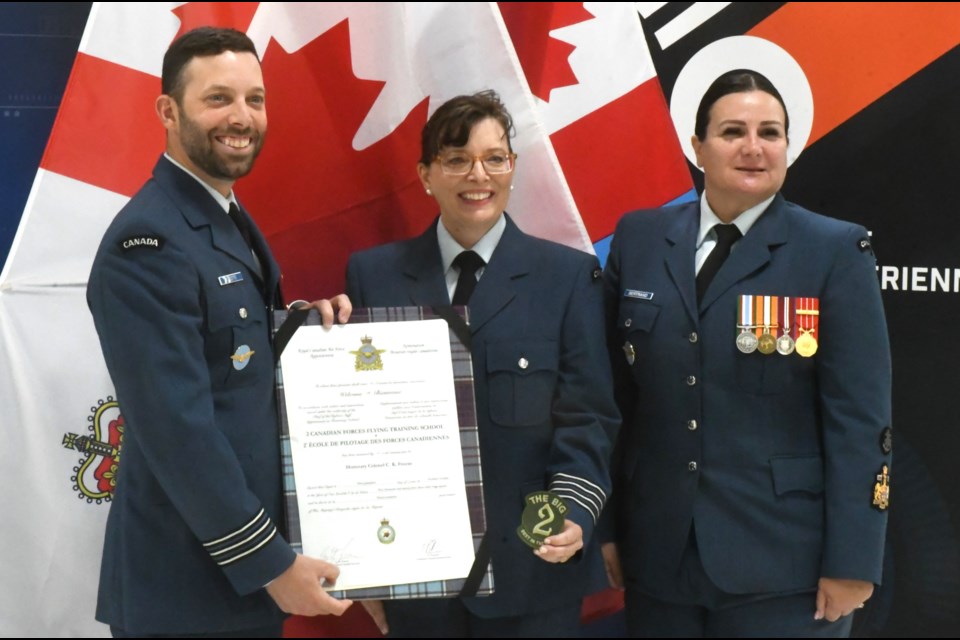 HCol Froese (centre) officially assumed the role of Honorary Colonel on Oct. 1. 