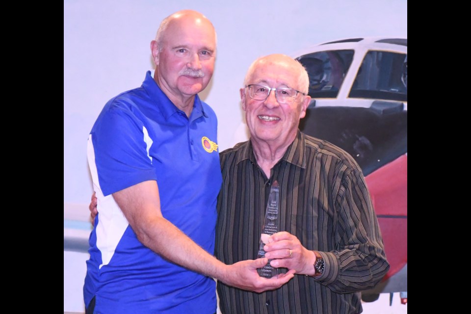 Phil Adkins, chairman of the Friends of the Forces Fellowship (left), presents the Lois Boyle Excellence in Community Service Award to Gord Johnson for his work as a tour guide. Photo by Jason G. Antonio