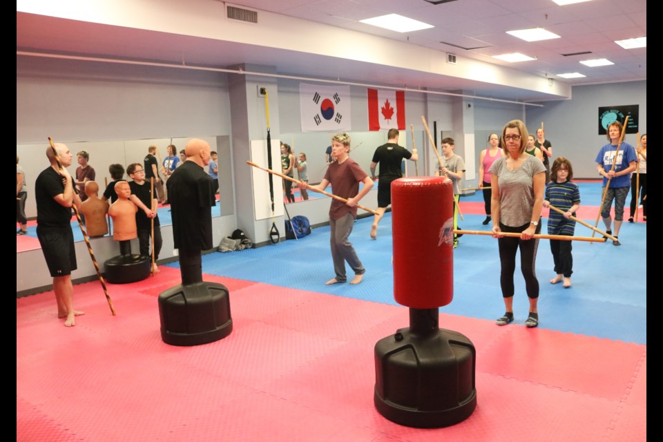 About 20 people came out for a free introductory class put on by Bojutsu Moose Jaw Saturday at Kim’s Taekwondo dojo. Photo by Shawn Slaght