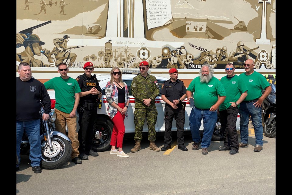 Volunteers with the Military Police National Motorcycle Relay stopping at the Royal Canadian Legion in Moose Jaw on July 10, 2023. 