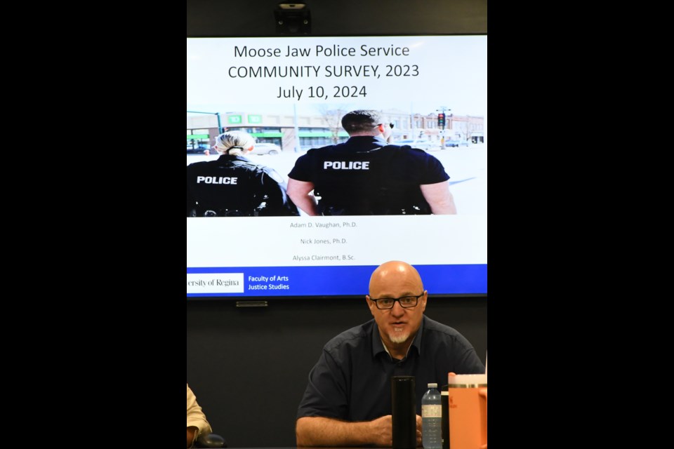 Dr. Nicholas Jones, a University of Regina justice studies professor, speaks to the police board about a new survey about the Moose Jaw Police Service. Photo by Jason G. Antonio