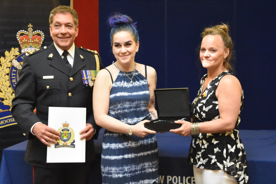 Police Chief Rick Bourassa (left) and Coun. Heather Eby present Brittany Kilgour with the Chief's Commendation award, during the fifth annual Police Service awards ceremony on May 29. Photo by Jason G. Antonio 