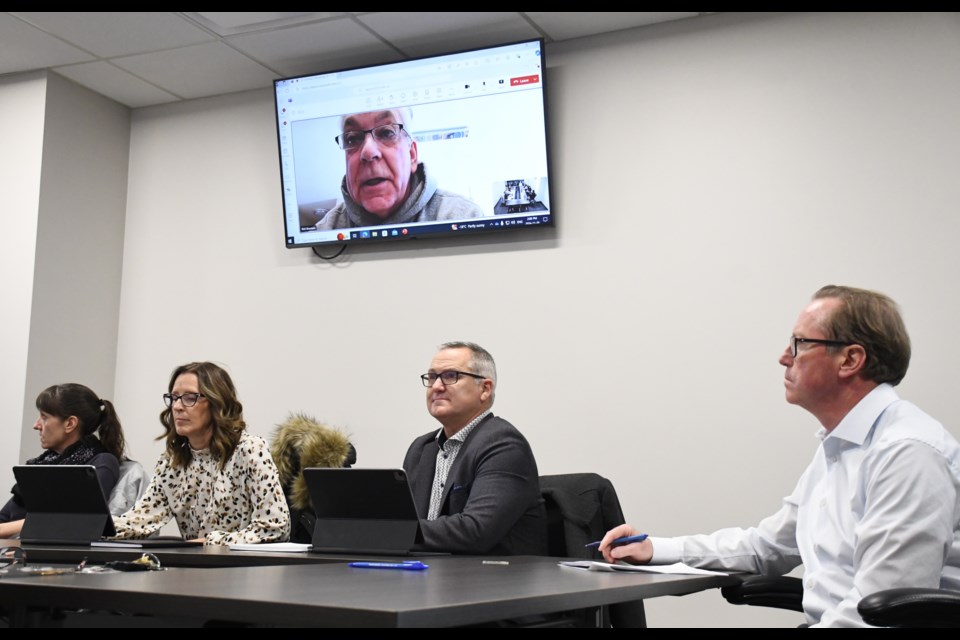 Police Chief Rick Bourassa (on screen) chairs the swearing-in ceremony. Photo by Jason G. Antonio