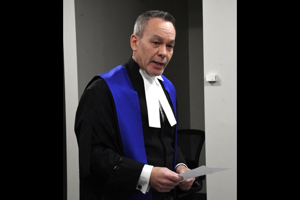 Judge David Chow speaks to the police board before the swearing-in ceremony commences. Photo by Jason G. Antonio